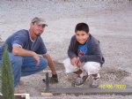 Picture Title - Isaiah and Dad checking cement