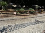 Picture Title - Dale is installing railroad signs on the posts that hold up the G gauge